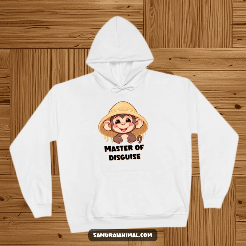 Funny hoodie depicting a nimble monkey character with a grin peeking from behind a straw hat, perfect for cozy mischief.