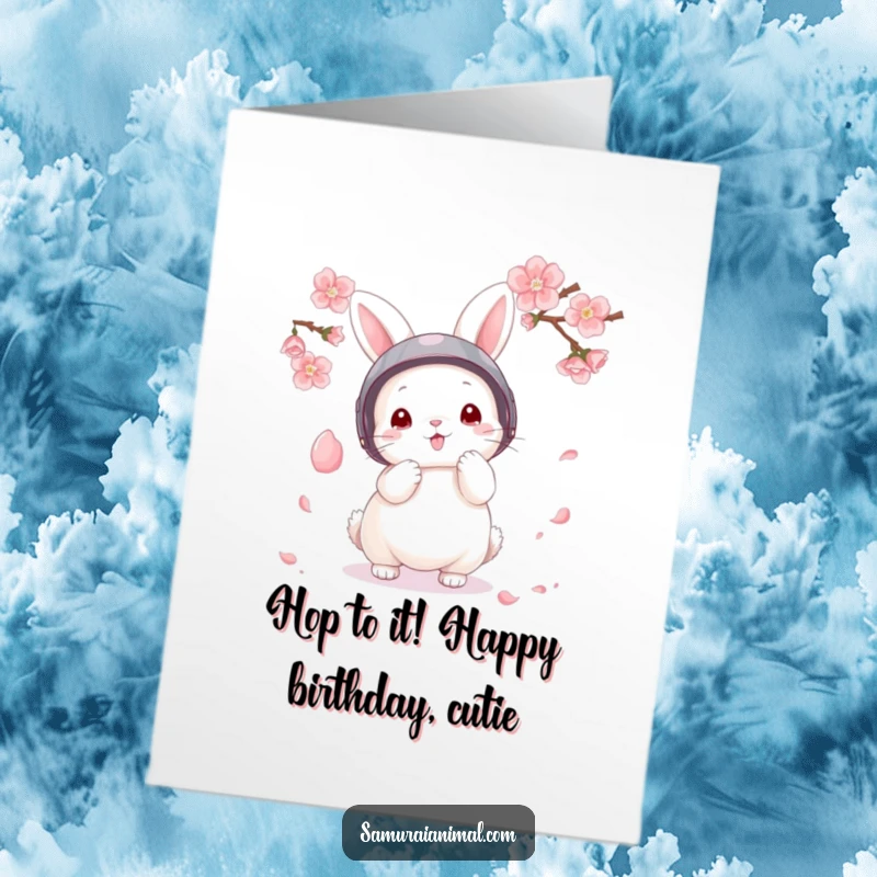 Funny Free Printable Bunny Warrior Birthday Card, a fluffy bunny in a helmet bravely parries a delicate cherry blossom petal.