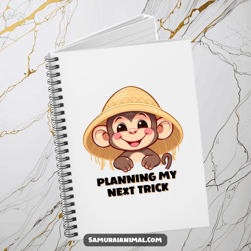 Funny notebook with a nimble monkey character grinning and peeking from behind a straw hat, perfect for notes and sketches.