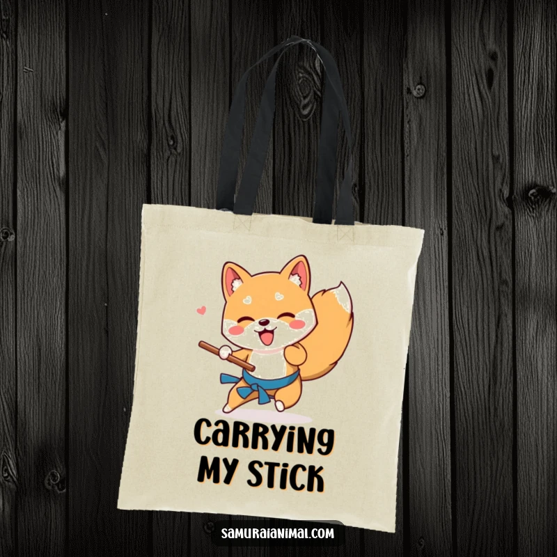 Funny Shiba Inu tote bag depicting a playful dog performing a low sweep with a wooden stick, ideal for dog park trips.