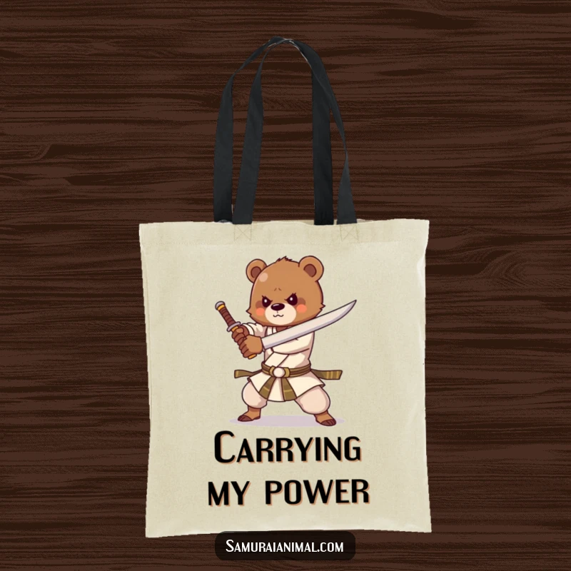 Funny tote bag depicting a strong bear cub practicing sword forms with great enthusiasm, showcasing playful power.